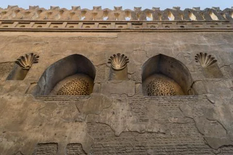 Two Mamluk era perforated arched stucco window decorated with floral patterns Stock Photos