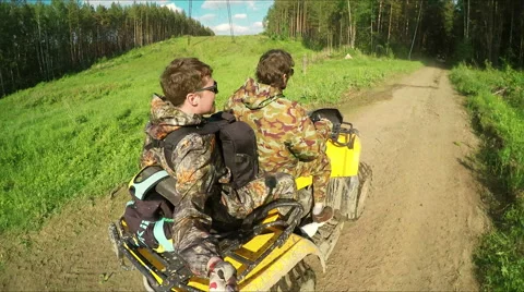 Two Man on ATV in forest video Selfe 스톡 동영상 57707312
