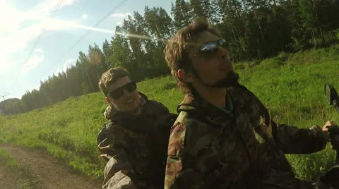 Two Man on ATV in forest video Selfe Stock Footage 57707387