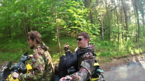 Two Man on ATV in forest video Selfe Stock Footage 57707454