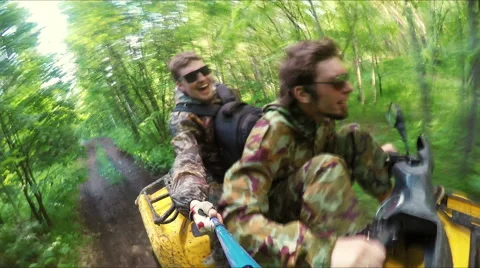 Two Man on ATV in forest video Selfe Stock Footage 57708199