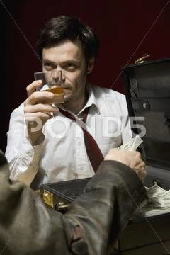 Two man doing a shady business deal Stock Photos