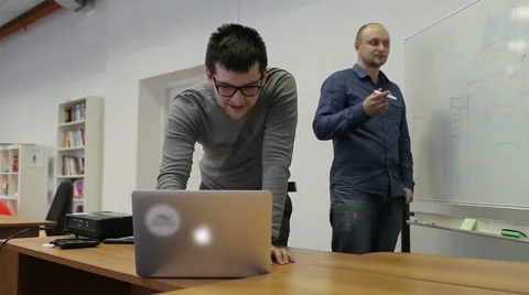 Two Man Draw Diagrams On The White Board And Discuss Video stock 52684628