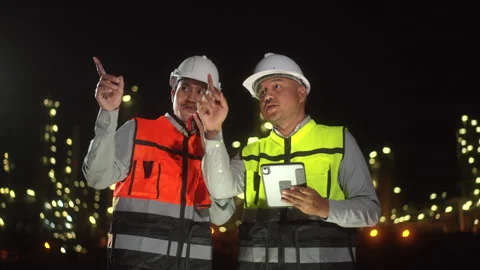 Two man engineer use tablet with white safety helmet standing meeting front. Stock Footage 273458658