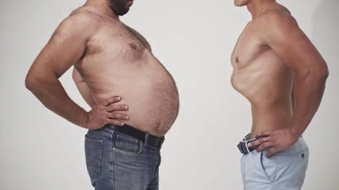 Two man funny belly shake. Crazy stomach dance. Overweight man joking. Calorie Stock Footage 301922833