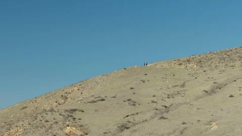 Two man hiking up a trail Stock Footage 88285165