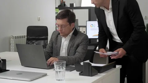 Two man at the office discuss documents. Stock Footage 116623908