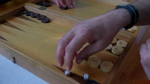 Two man playing backgammon and rolling dice. 4K Stock Footage 195657925