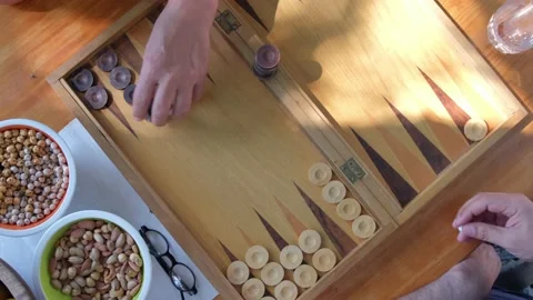 Two man playing backgammon and rolling dice. 4K Stock Footage 195661107