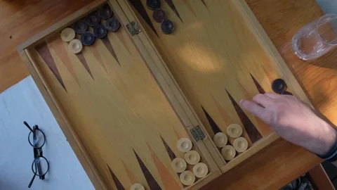 Two man playing backgammon and rolling dice. 4K Stock Footage 195661132