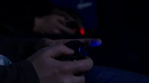 Two Man playing with a videogame controller in his hands Video stock 85187586