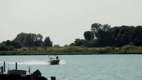 Two man in a small speedboat. Stock Footage 95438277