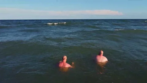 Two man swimming in the open ocean Video stock 133491545