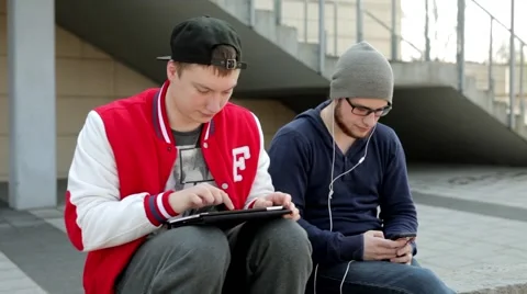 Two man with tablet playing in ,, scissors, paper, stone’’ 64 Stock Footage 49535674