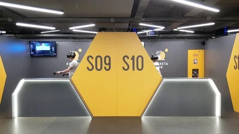 Two man in VR glasses are playing video games. People have fun Video stock 99137450