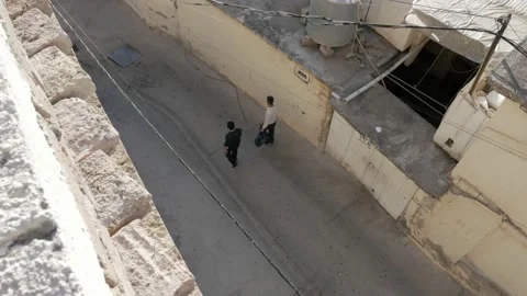 Two man walking in the suburbs of a city in Iraqi Kurdistan Video stock 134891081