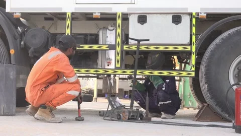 Two man weld the underside of the car Video stock 144800349