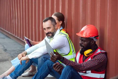 Two manager and one engineer sit and discuss  to customer.  Stock Photos