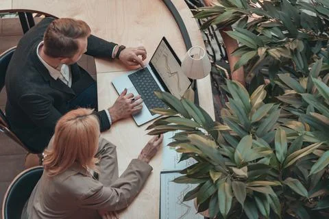 Two managers discussing new strategy. Group of business people working together Stock Photos