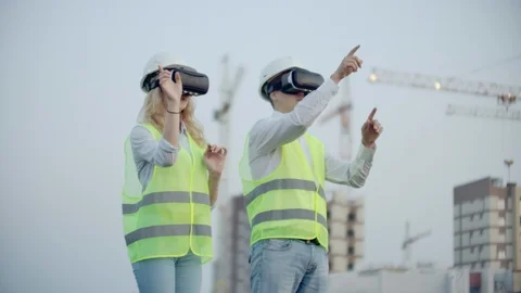 Two managers of the future on the construction site use virtual reality glasses Stock Footage 114421886