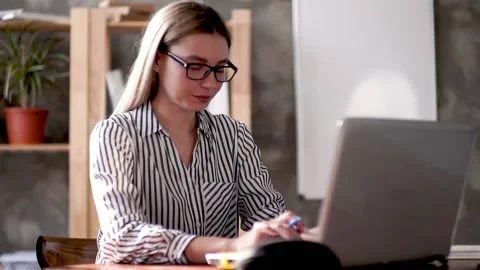 Two managers .the head turns to a colleague, shows the task for today on the Stock Footage 131599306