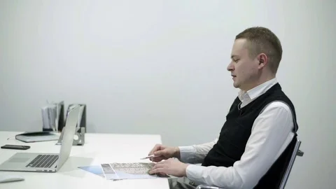 Two managers sit at the table in the office and discuss the project Stock Footage 82130507