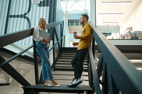 Two managers talks on stairs in IT office Stock Photos