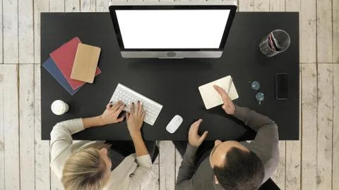 Two managers working discussing project on the screen of computer. White Display Stock Photos
