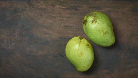 Two mangoes on a table top with copy space Stock Photos