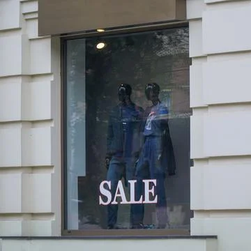 Two mannequins in the window Stock Photos