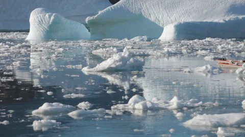 Two mans moving on kayaks moving in the middle of Arctic Ocean, Greenland Stock Footage 100872760