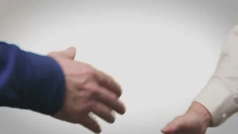 Two mans shaking hands. CloseUp shot. Isolated on white. Stock Footage 120358495