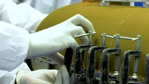 Two Manufacturing Workers Using A Clamp To Seal Device CLOSE UP Stock Footage 171986607