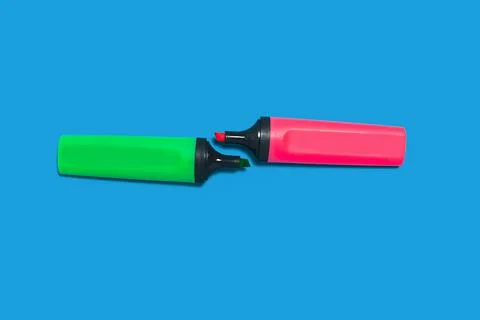 Two markers on a blue cloth Stock Photos