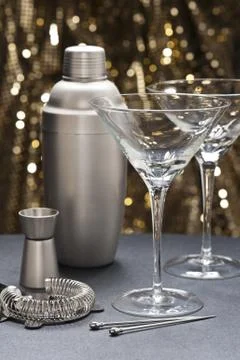 Two martini glasses with bartender tools Stock Photos