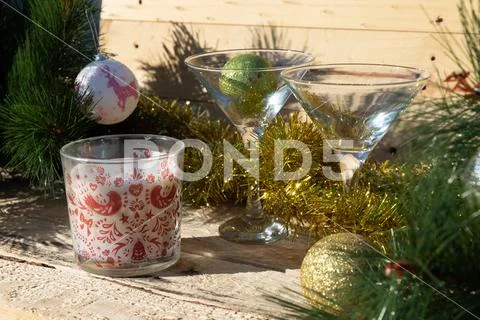 Two martini glasses surrounded by new year decorations Stock Photos