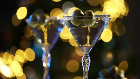 Two Martinis with Olives on a Festive Table Stock Footage 303412284