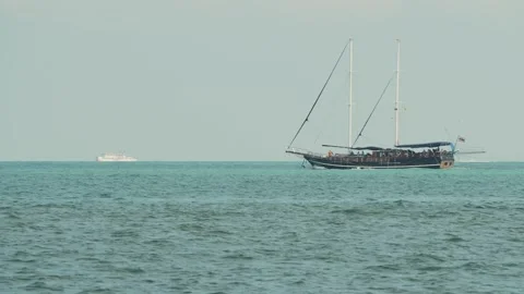 Two masted ship sails in tropical sea Stock Footage 331621927