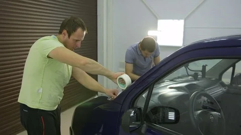 Two master tape to glue car polishing, the preparatory process Stock Footage 71341430