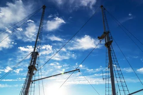Two masts of a ship against the blue sky Foto stock