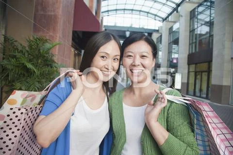Two Mature Women In Shopping Mall Stock Photos