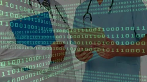 Two MDs tilting tablet, reviewing medical data, checking blue folder, green Stock Footage 333833906