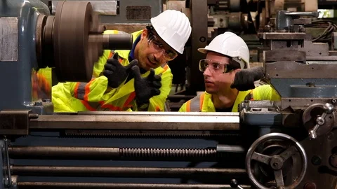 Two mechanic engineer discussing together about machine in factory. Stock Footage 125620397