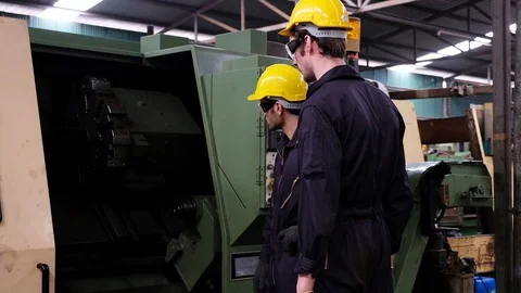 Two mechanical engineer talk about machine operation procedure. Stock Footage 125620363