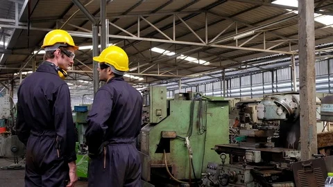 Two mechanical engineer talk about improvement plan machine in factory. 動画素材 127506074