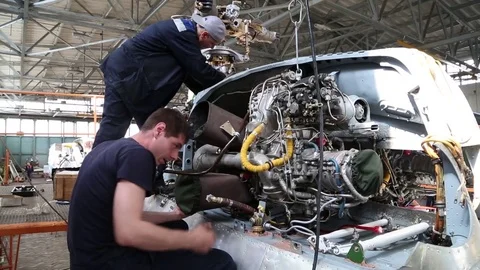 Two mechanics fixing car in a workshop Stock Footage 81205835