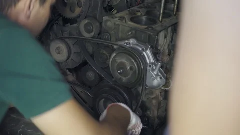 Two mechanics repair car engine close-up Stock Footage 110862775