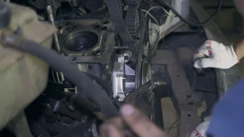 Two mechanics repair car engine closeup Stock Footage 110862877