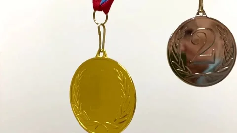 Two medals for 1st and 2nd place on a white-blue-red ribbon on a gray background Video stock 168328173