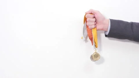 Two medals in man's hand Stock Footage 151922651